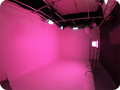 inside a hollywood film stage as Rgb led lights change the studio color to lavender mainstream entertainment Los angels privet studio rental location